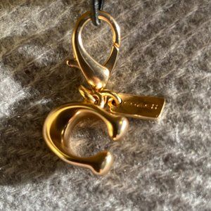 COACH Signature Bag Charm Metal Brass Metal brass Charm with dog leash clip.